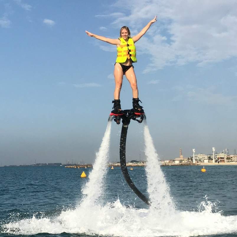 a female client on the flyboard during a session