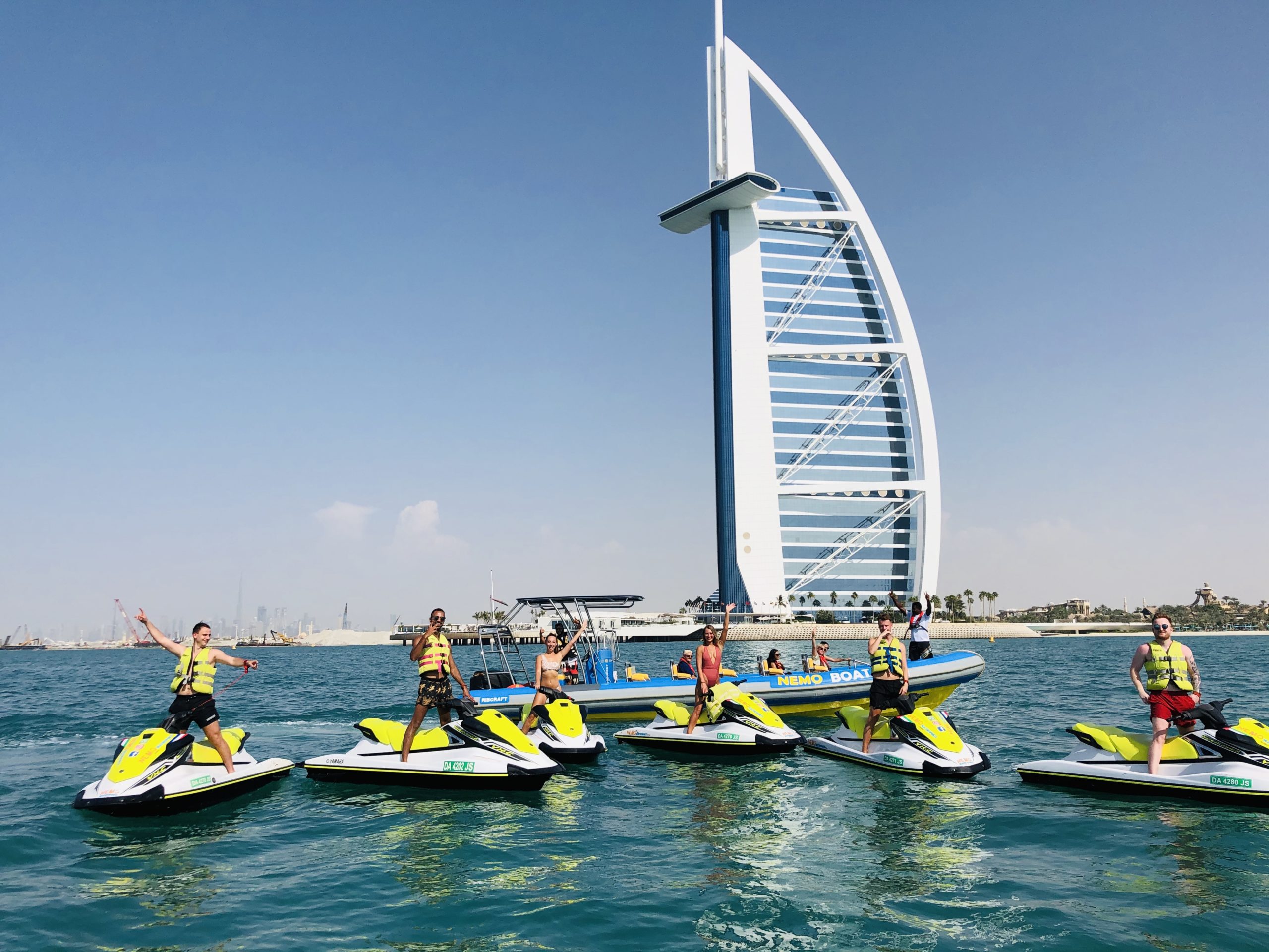 customers during a jet ski stop in front of the Burj Al Arab